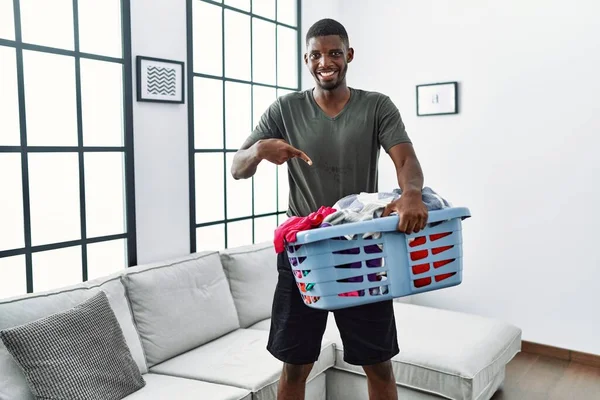 Young African American Man Doing Laundry Holding Basket Smiling Happy — Foto de Stock