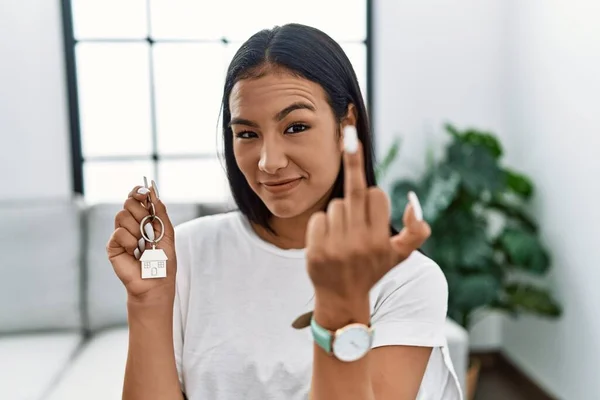 Young Hispanic Woman Holding Keys New Home Showing Middle Finger —  Fotos de Stock