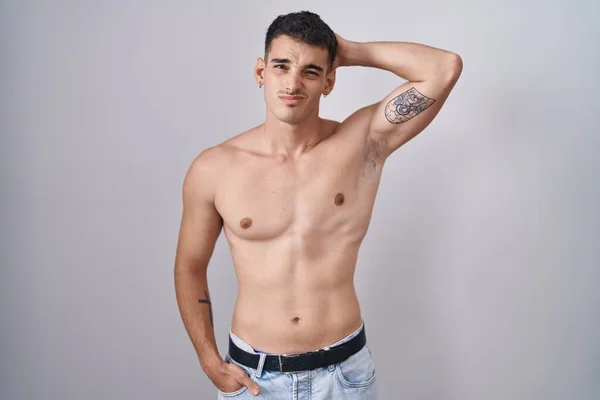 Handsome Hispanic Man Standing Shirtless Confuse Wondering Question Uncertain Doubt — Stock Photo, Image