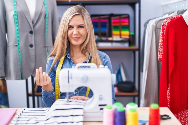 Blonde Woman Dressmaker Designer Using Sew Machine Doing Money Gesture — 图库照片