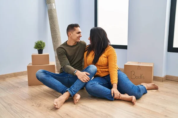 Young Couple Sitting Floor New Home Looking Side Relax Profile — Stock Photo, Image