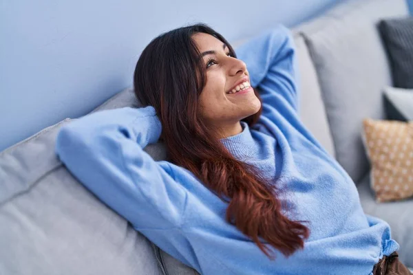 Young Hispanic Woman Relaxed Hands Head Sitting Sofa Home — Stock Photo, Image