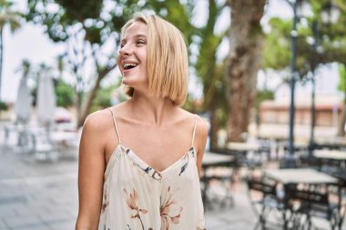 Young beautiful woman smiling confident outdoor