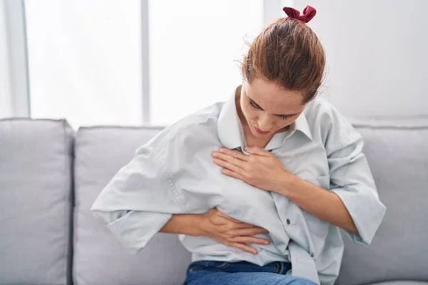 Young Woman Examining Breast Sitting Sofa Home — Stock Photo, Image