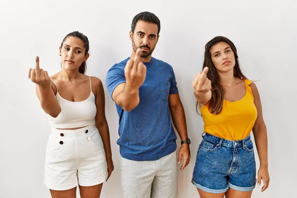 Group Young Hispanic People Standing Isolated Background Showing Middle Finger — Stockfoto