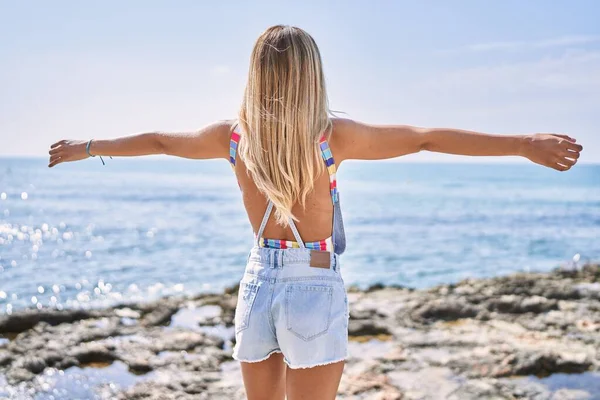 Young Blonde Girl Back View Breathing Arms Open Standing Beach — Photo