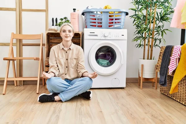 Young Caucasian Woman Doing Yoga Waiting Washing Machine Laundry Room — Stockfoto