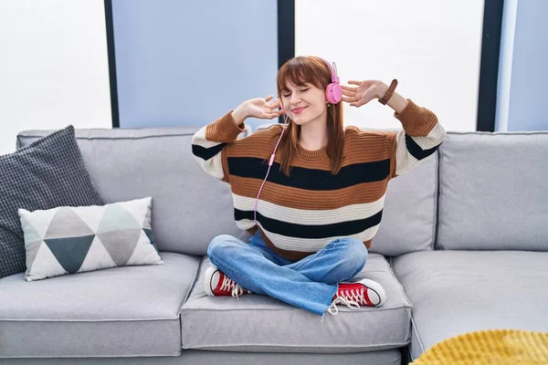 Young Woman Listening Music Sitting Sofa Home — Stockfoto