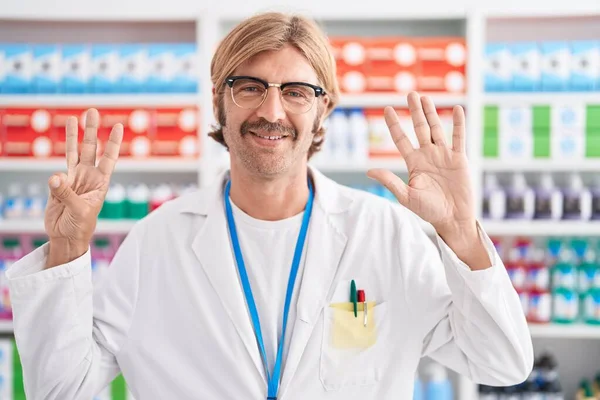 Caucasian Man Mustache Working Pharmacy Drugstore Showing Pointing Fingers Number — Stock Photo, Image