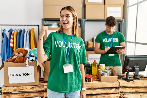 Young Blonde Girl Wearing Volunteer Shirt Donation Stand Smiling Happy — Stock Photo, Image