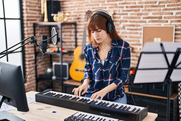 Young Woman Musician Playing Piano Keyboard Music Studio — стоковое фото