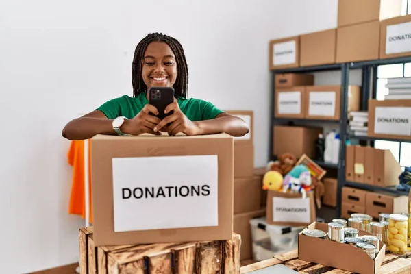Young African American Woman Wearing Volunteer Uniform Using Smartphone Charity — Stock Photo, Image