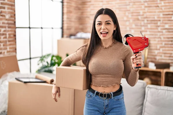 Young Woman Moving New Home Packing Boxes Celebrating Crazy Amazed — Stockfoto