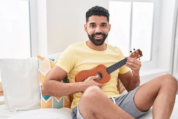 Young Arab Man Playing Ukulele Sitting Bed Bedroom — Stock Photo, Image