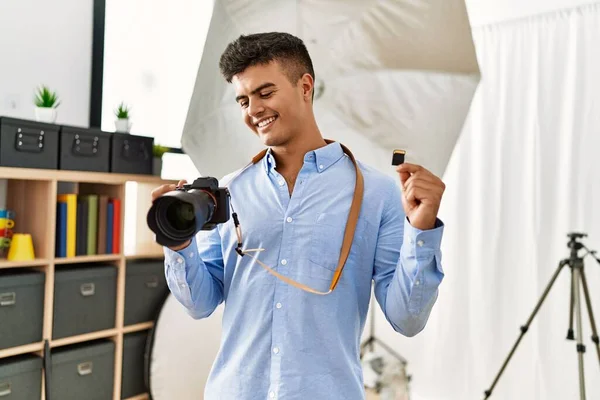 Young Hispanic Man Photographer Holding Professional Camera Memory Card Photography — Stock Photo, Image