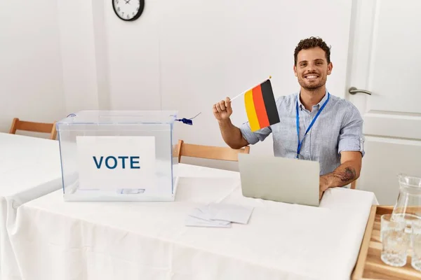 Young Hispanic Man Smiling Confident Holding Germany Flag Working Electoral — стокове фото