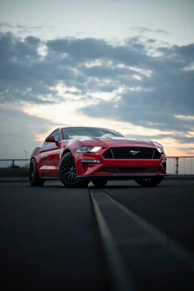 Wroclaw, Poland - August 15, 2022: Ford Mustang GT with shiny red paint evening shot
