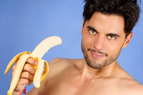 Bello uomo con banana — Foto Stock