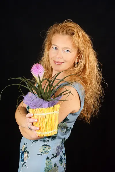 Blond woman with plant — Stock Photo, Image