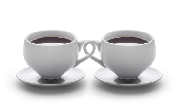 Coffee cups intertwined — Stock Photo, Image