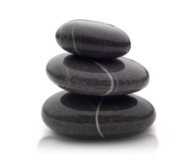 three beautiful shiny black river stones stacked on top of each other with a shadow at the base