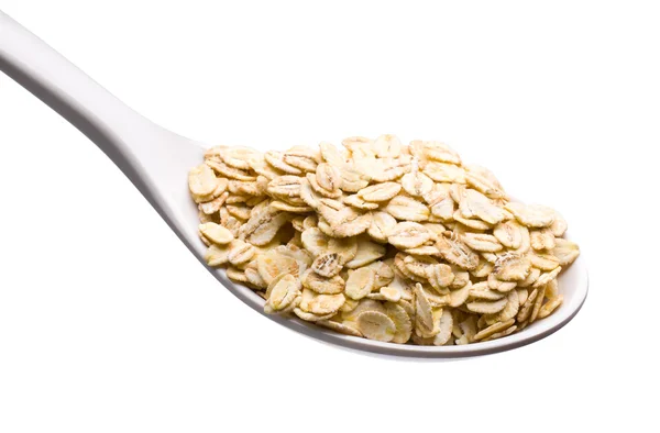 Spoon and oatmeal — Stock Photo, Image