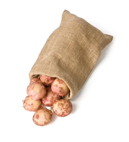 Aardappelen in jute zak — Stockfoto