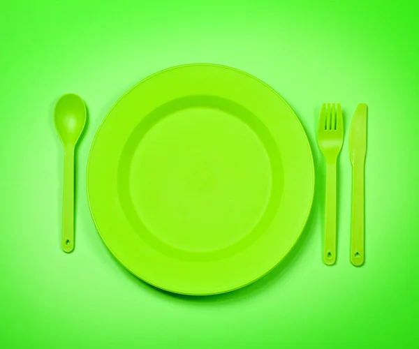 Yeşil plastik tek kullanımlık tablewar — Stok fotoğraf