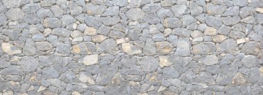 Tasarımınız için vahşi taş duvar arka planı