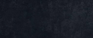 Koyu gri duvar geniş panoramik doku. Grunge gri alçı geniş uzun yüzey. Geniş ekran arkaplanı soyut