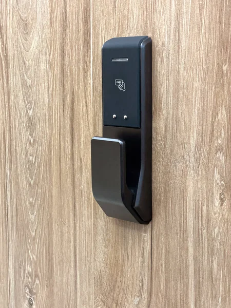 Smart card door key lock system in hotel isolated on wooden background