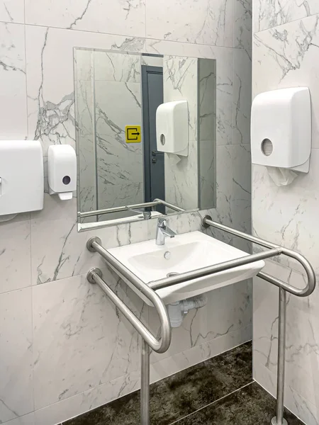 Bathroom interior for disabled or elderly people. Handrail for disabled and elderly people in the bathroom
