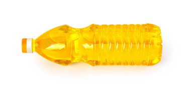 a plastic bottle of oil lies on a white background with clipping path