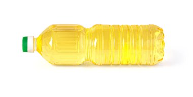 a plastic bottle of oil lies on a white background with clipping path