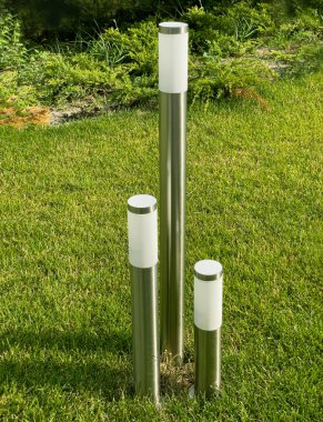 Elactric lamp on green grass background. Selective focus.