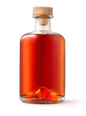 A full bottle of whiskey is isolated on a white background