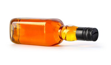 A full bottle of whiskey is isolated on a white background with clipping path
