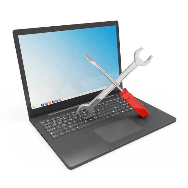 Laptop servicekoncept. modern laptop med skiftnyckel och skruvmejsel isolerad på vit bakgrund — Stockfoto