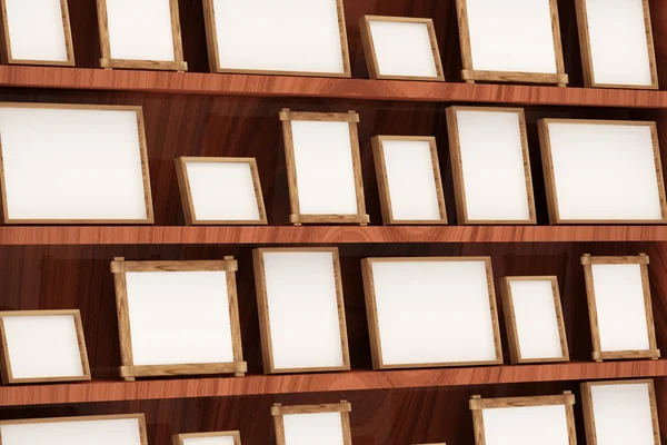 Primer plano de los marcos de fotos vacíos en el estante de madera —  Fotos de Stock