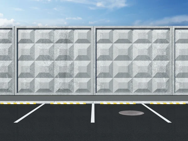 Parkplatz nahe der Betonmauer mit schönem Himmel dahinter — Stockfoto