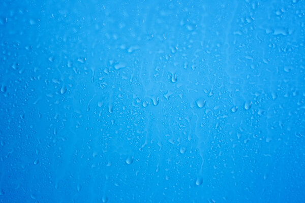 Raindrops on blue background