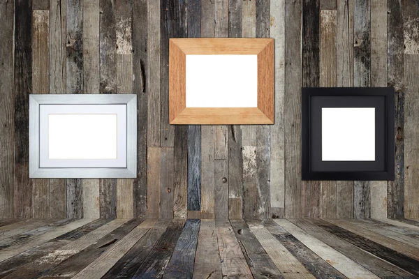 Wooden picture frames on the old wooden wall — Stock Photo, Image