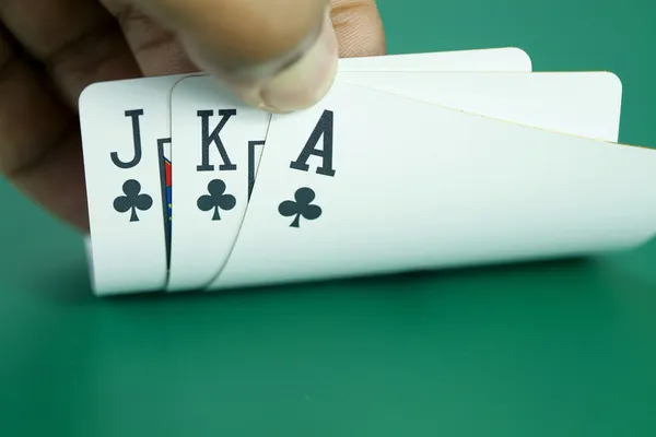 Playing cards in people hand — Stock Photo, Image