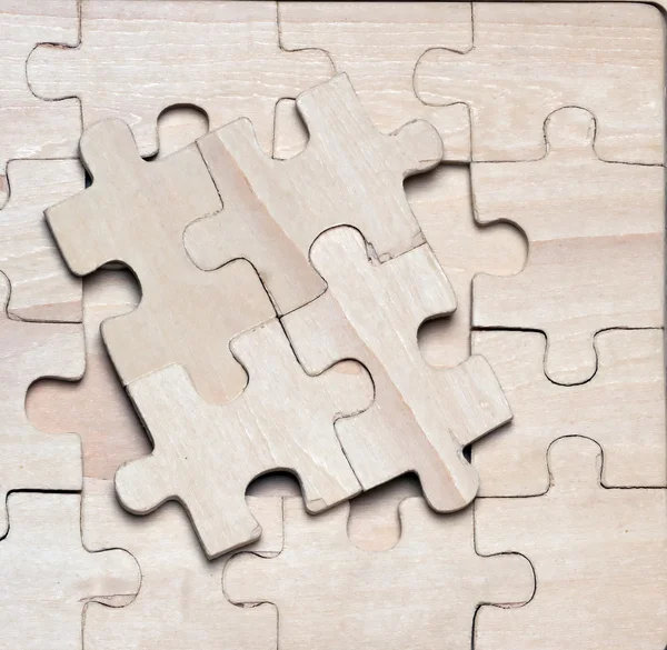 Wooden puzzles. — Stock Photo, Image