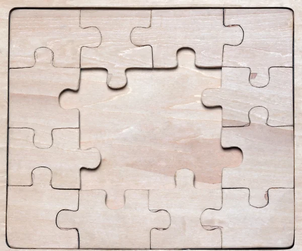 Wooden puzzles. — Stock Photo, Image