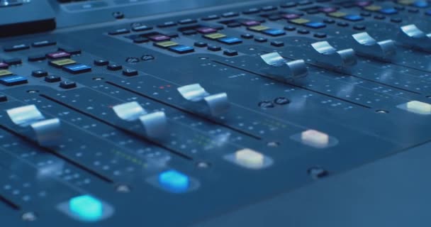 Modern sound equipment.Close-up of beautifully illuminated buttons,equalizers and indicators of the digital audio mixer — Stock Video