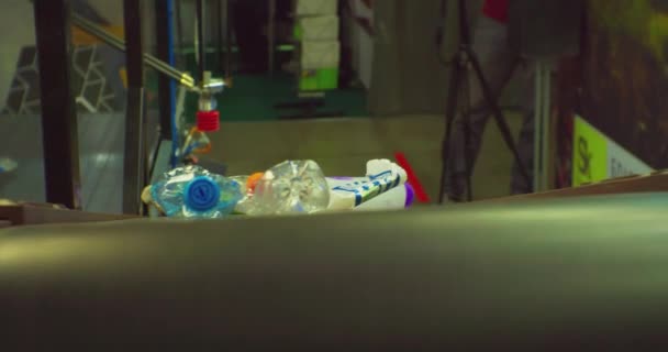 Modern industrial recycling of plastic waste. Plastic bottles move on a conveyor belt for the recycling process.close-up — Stock Video