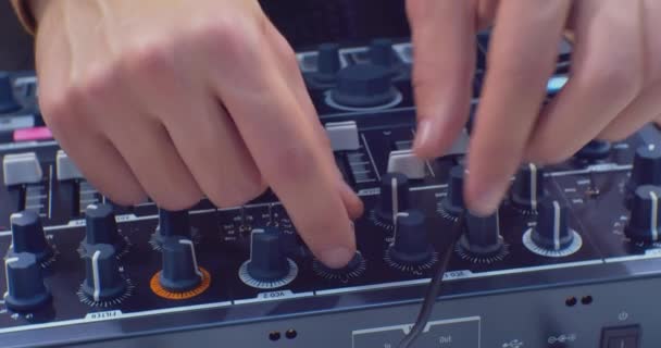 Modern sound equipment. musician hands operating a digital audio mixer.close-up — Stock Video