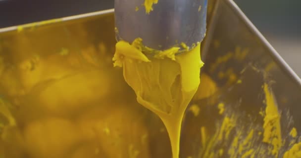 Modern food production. thick cream falls from a pipe into a hopper. close-up — Stock Video