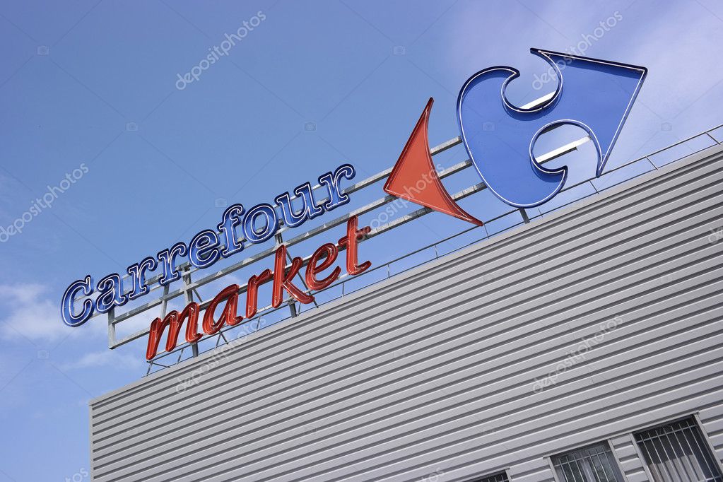 DUCEY, FRANCE - JULI 2014 - Brand name on facade of a Carrefour supermarket - Carrefour is a French multinational retailer, It is one of the largest hypermarket chains in the world